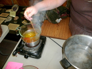 Melting beeswax to make the salve. Infused oils were added to customize the salve, which could also be a lip balm.